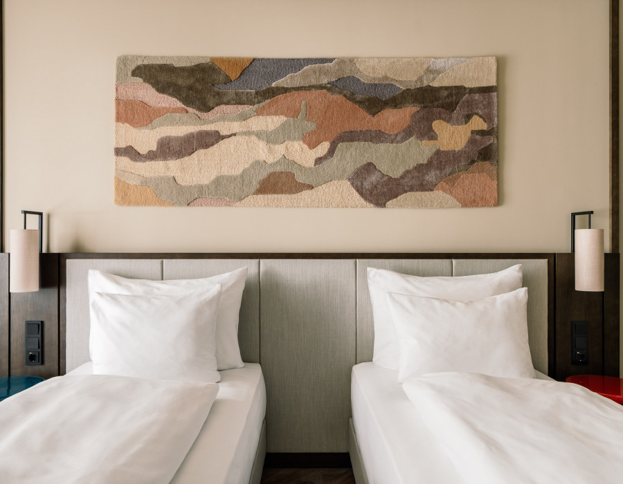 Two twin beds in a double room at Hotel Schani City