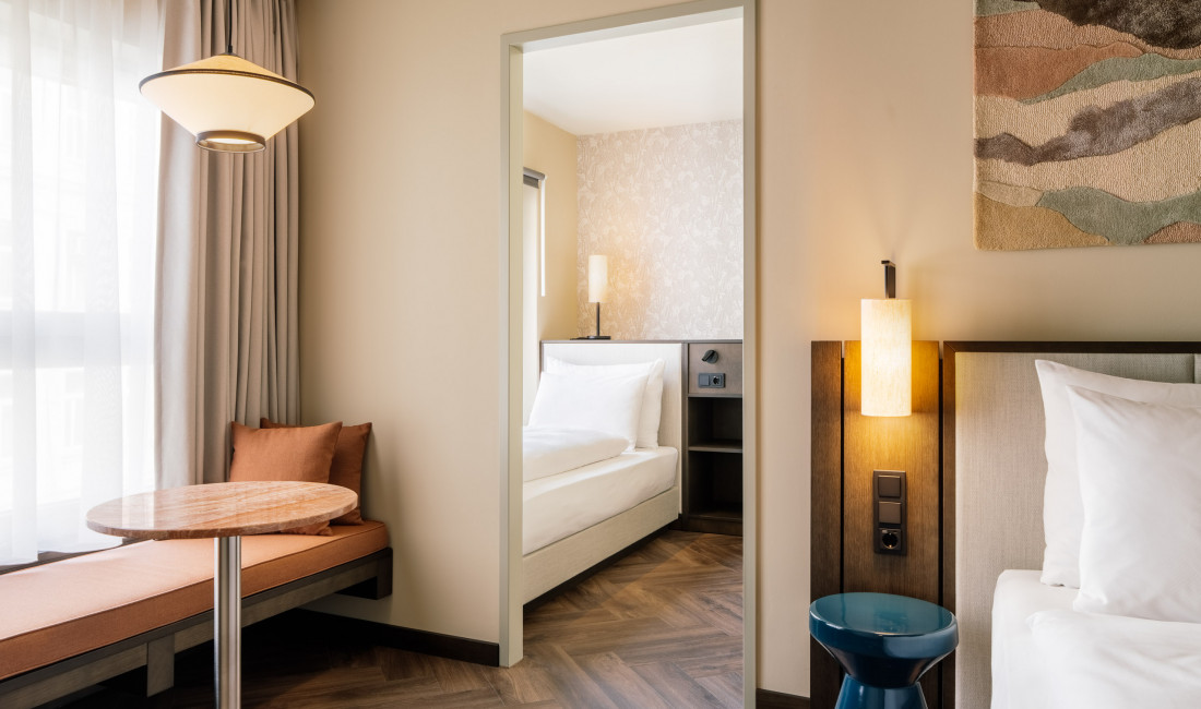 Double bed and single bed in a Smart Triple Room at Hotel Schani City