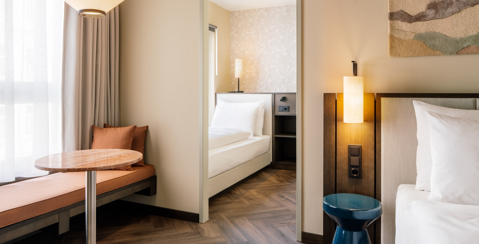 Double bed and single bed in a hotel room for three people 