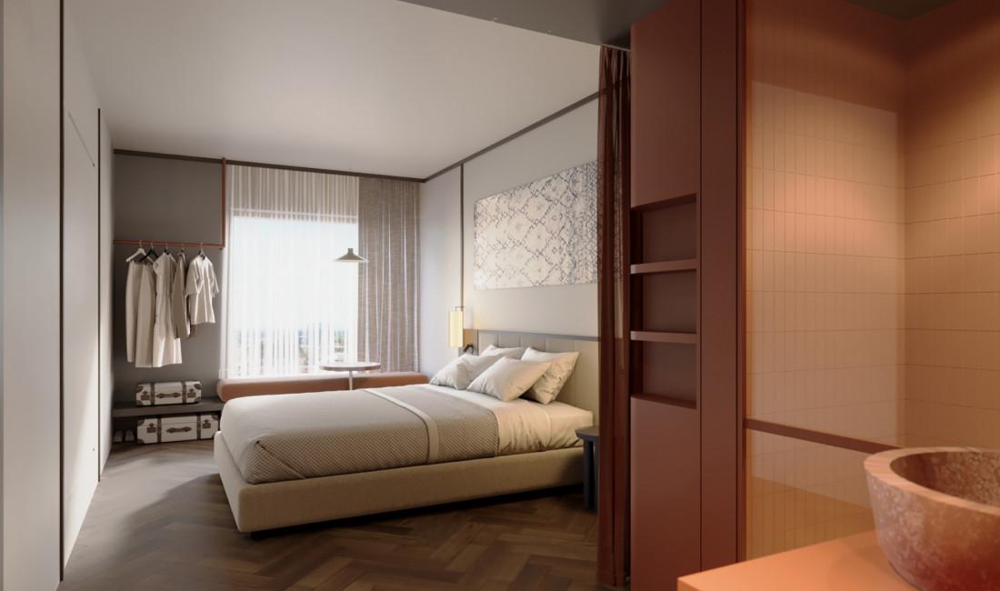 Doppelbett und Sitzbank vor einem großen Fenster im Hotel Schani City