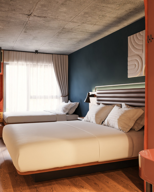 Doppelbett und Einzelbett in einem Zimmer im Hotel Schani Naschmarkt