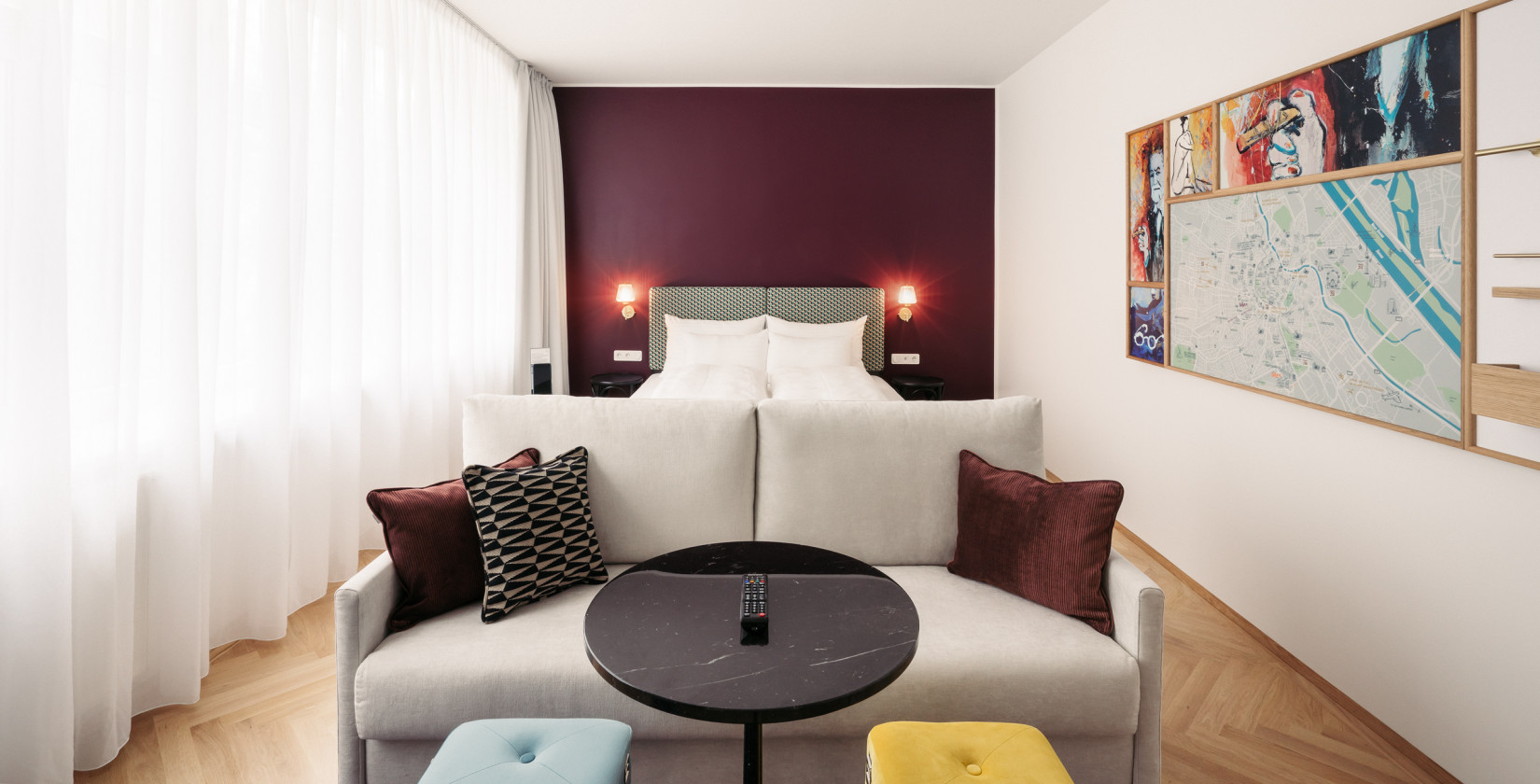 Bed and sofa in room Smart Atelier in Hotel Schani Salon 