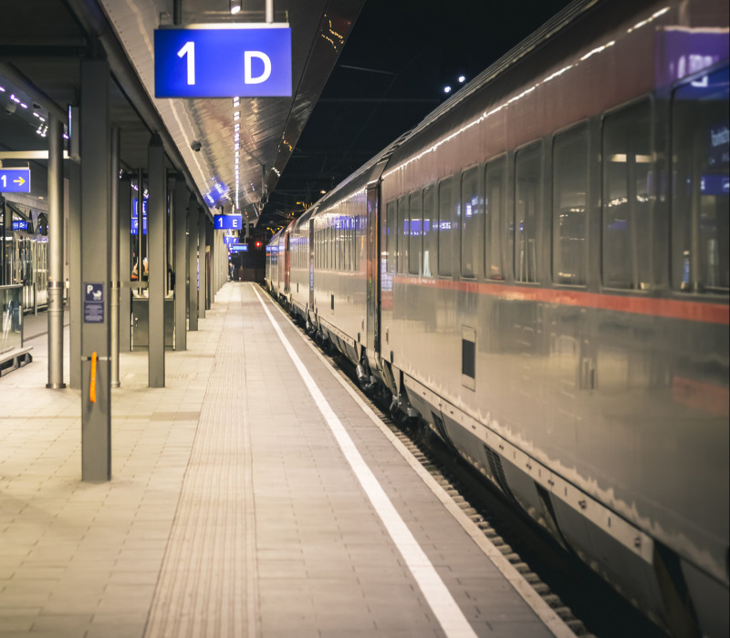 Platform with waiting train in station