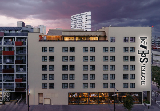 Exterior view of Hotel Schani Vienna with roof terrace at sunset