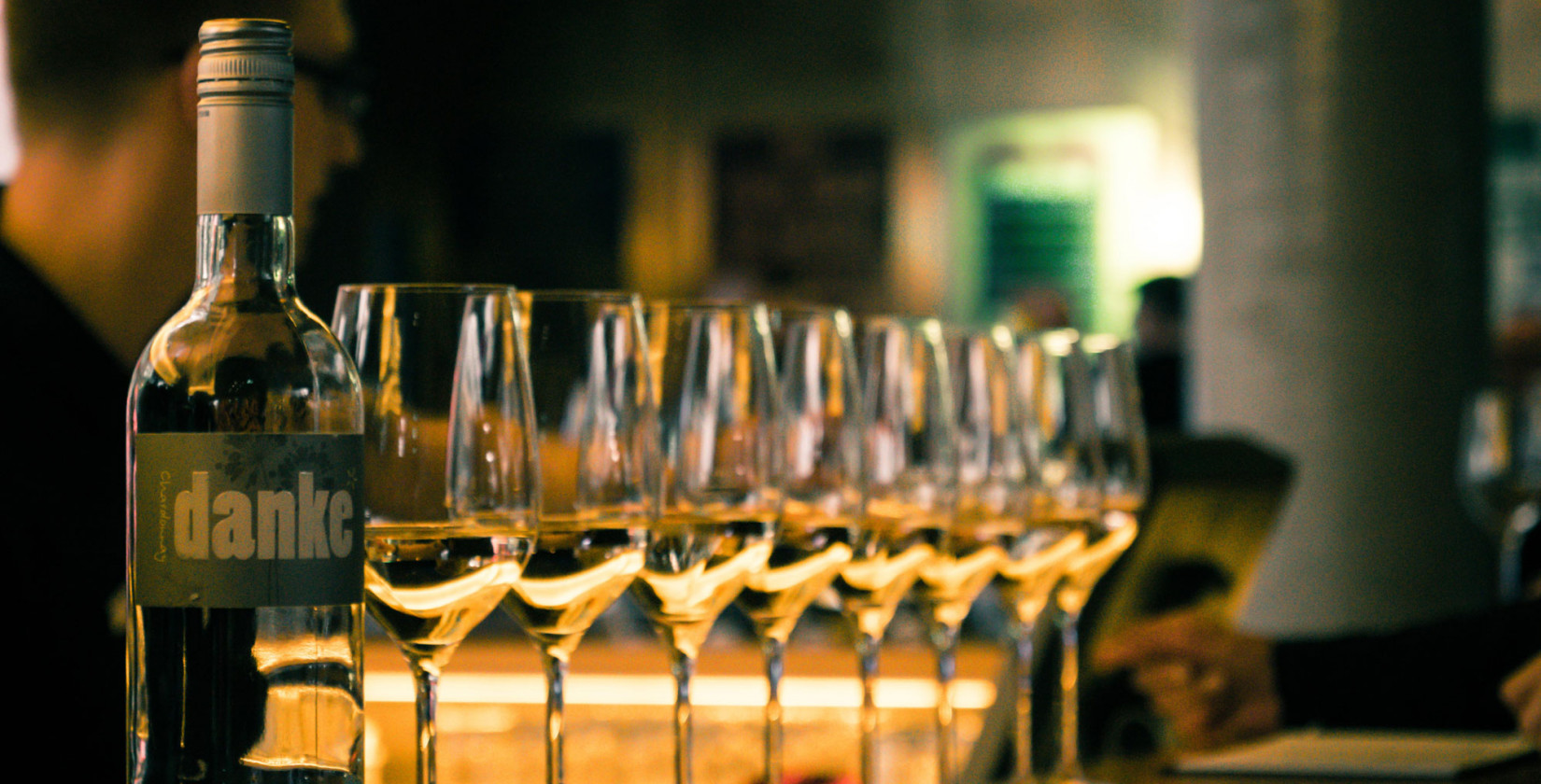 Wine glasses with white wine at the bar in hotel Schani Wien 