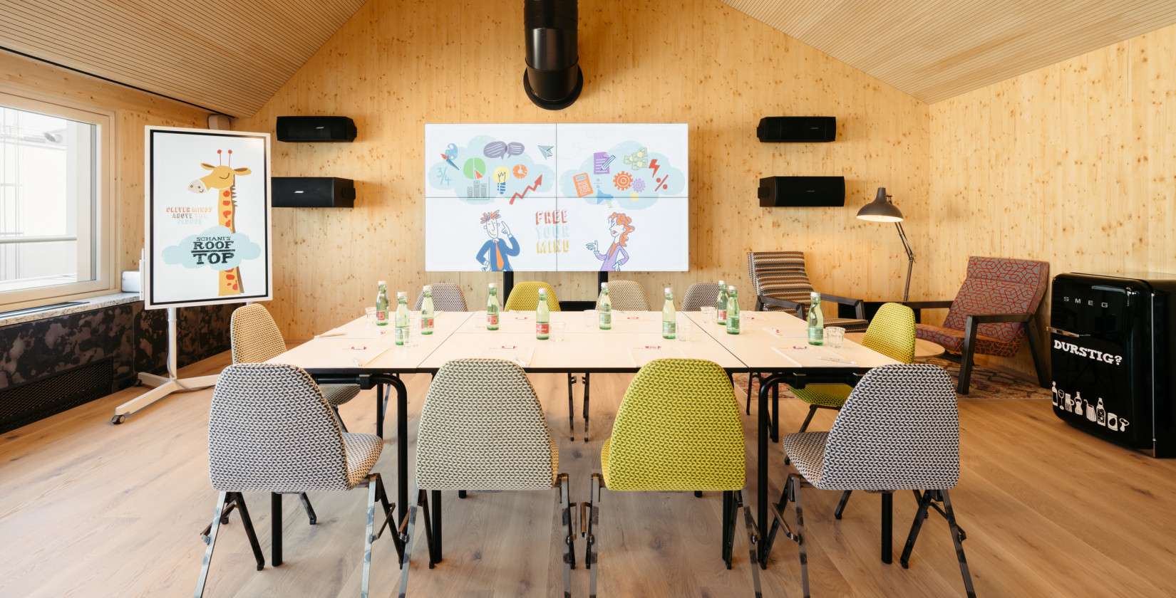 Prepared conference room with whiteboard and refrigerator in Hotel Schani Wien