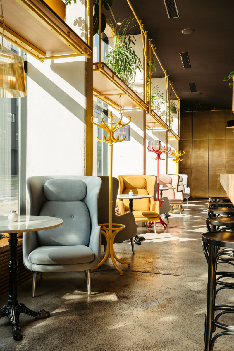 Comfortable chairs in the sunny lobby of Hotel Schani Wien