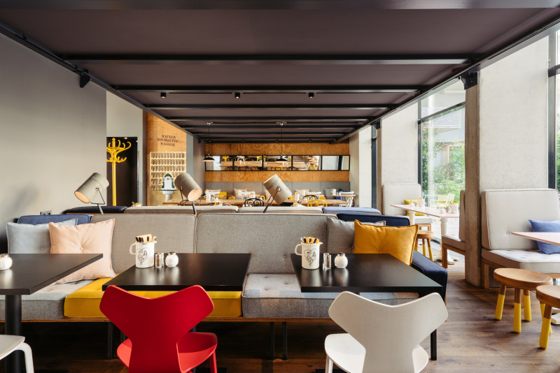 Colorful chairs in the lobby of Hotel Schani Wien