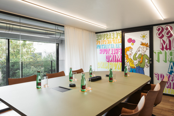 Prepared meeting table in meeting room with view from window