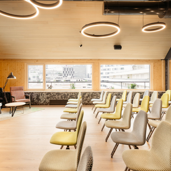 Seminar room with a large screen in the rooftop event space at Hotel Schani Wien