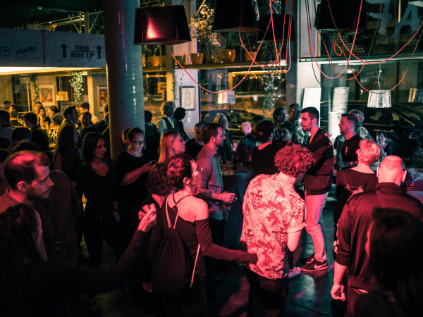 Numerous guests dance at a party in the lobby