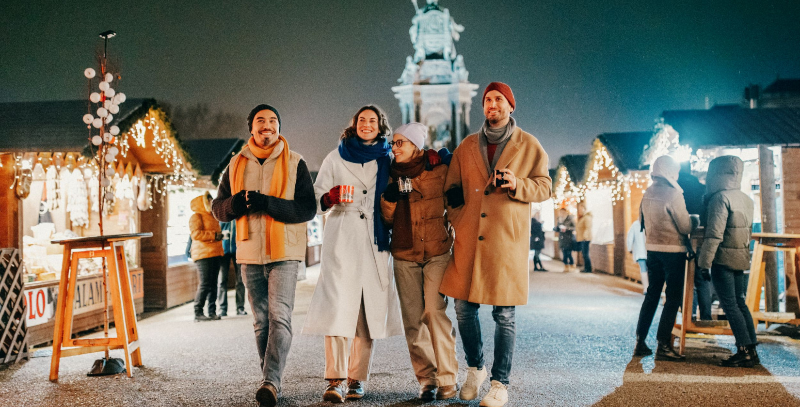 Visitors strolling through a Christmas market in Vienna