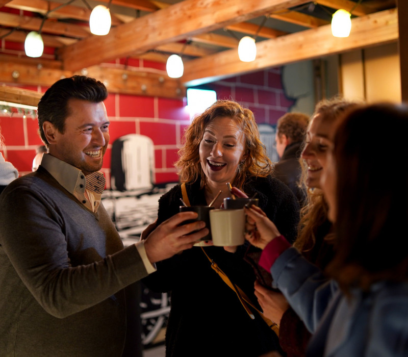 Guests at a christmas party in Vienna drinking punch