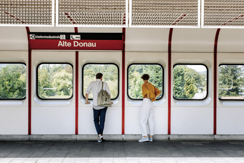 Two people standing at the subway station Alte Donau in Vienna